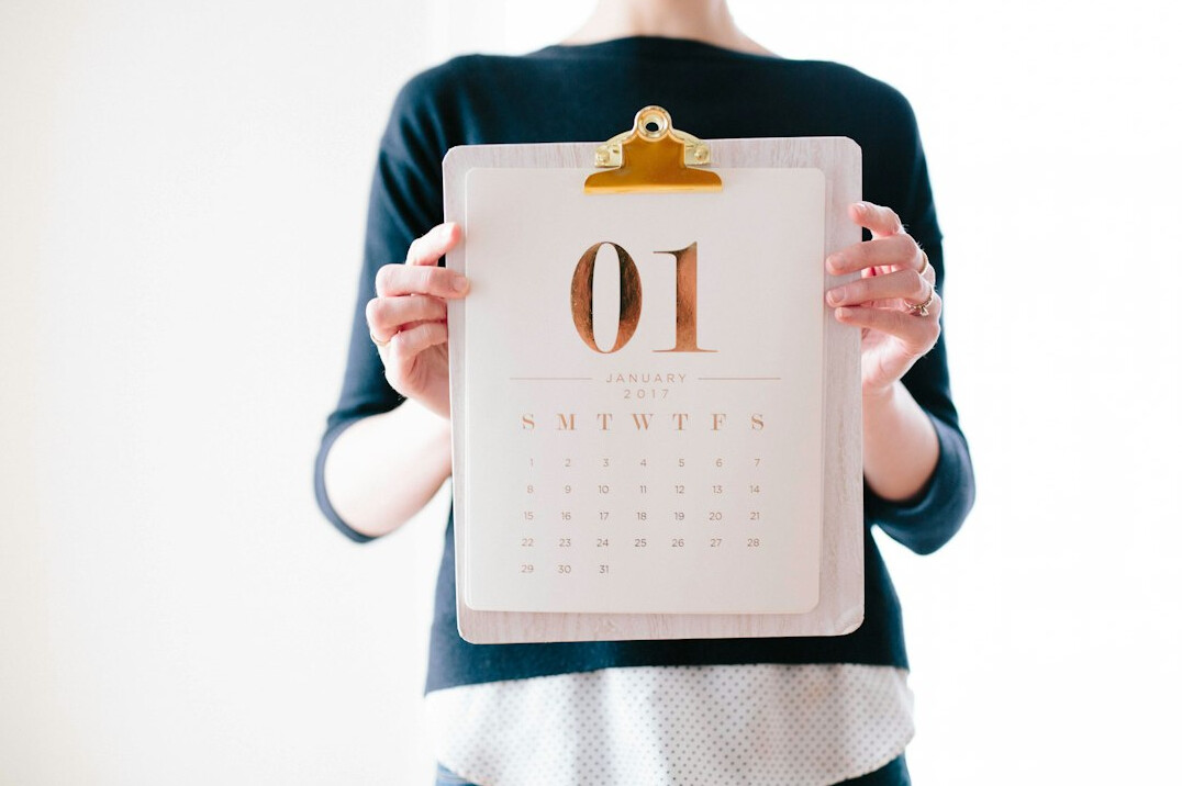 person planning on calendar